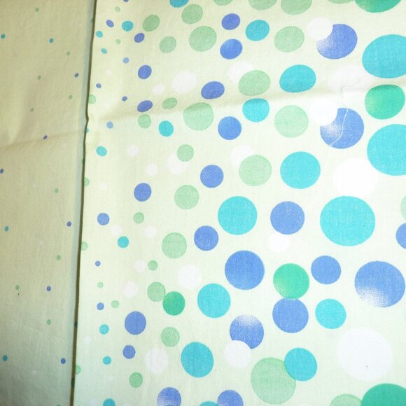 Fabric with an asymmetrical pattern of white, blue, and green bubbles - Picture 1 of 3